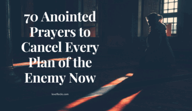A person standing in prayer as dark clouds part above them