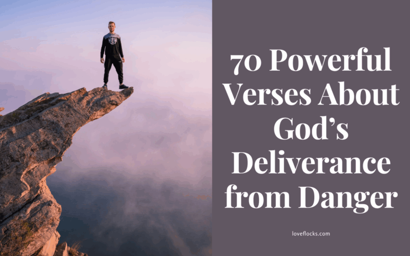 A person standing on a cliff edge with arms raised toward a sunrise