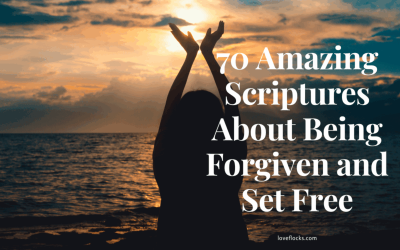 A person standing with arms lifted at sunrise near a calm sea