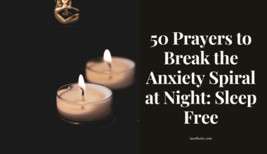 Two lighted candles in the dark, symbolizing grief and mourning