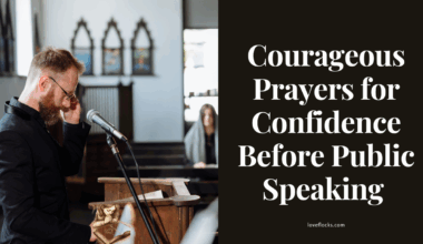 A person standing at a podium, hands resting on a Bible, praying for confidence before speaking to an audience.